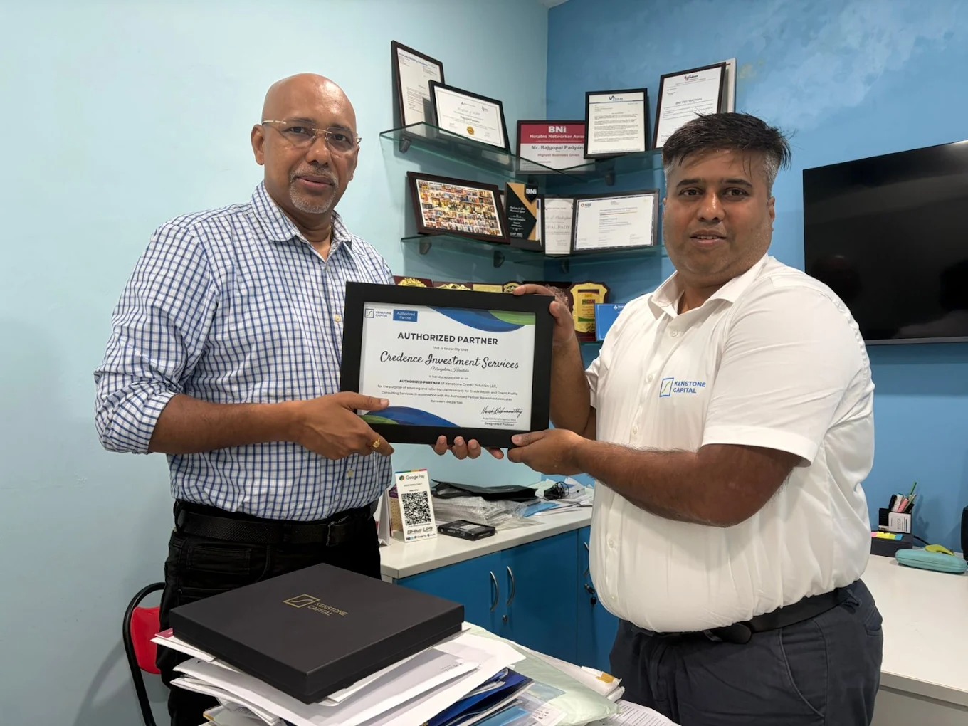 Rajgopal Padyar of Credence Investment Services receiving the Kenstone Authorized Partner certificate at the Credence office in Mangalore